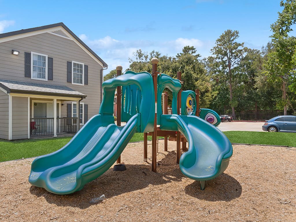 Playround slide at Park Village Apartments in Conroe TX